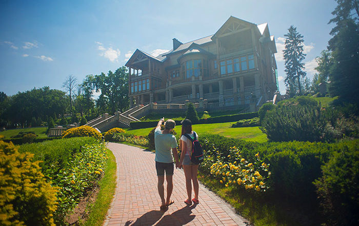 Couple walking close to a house